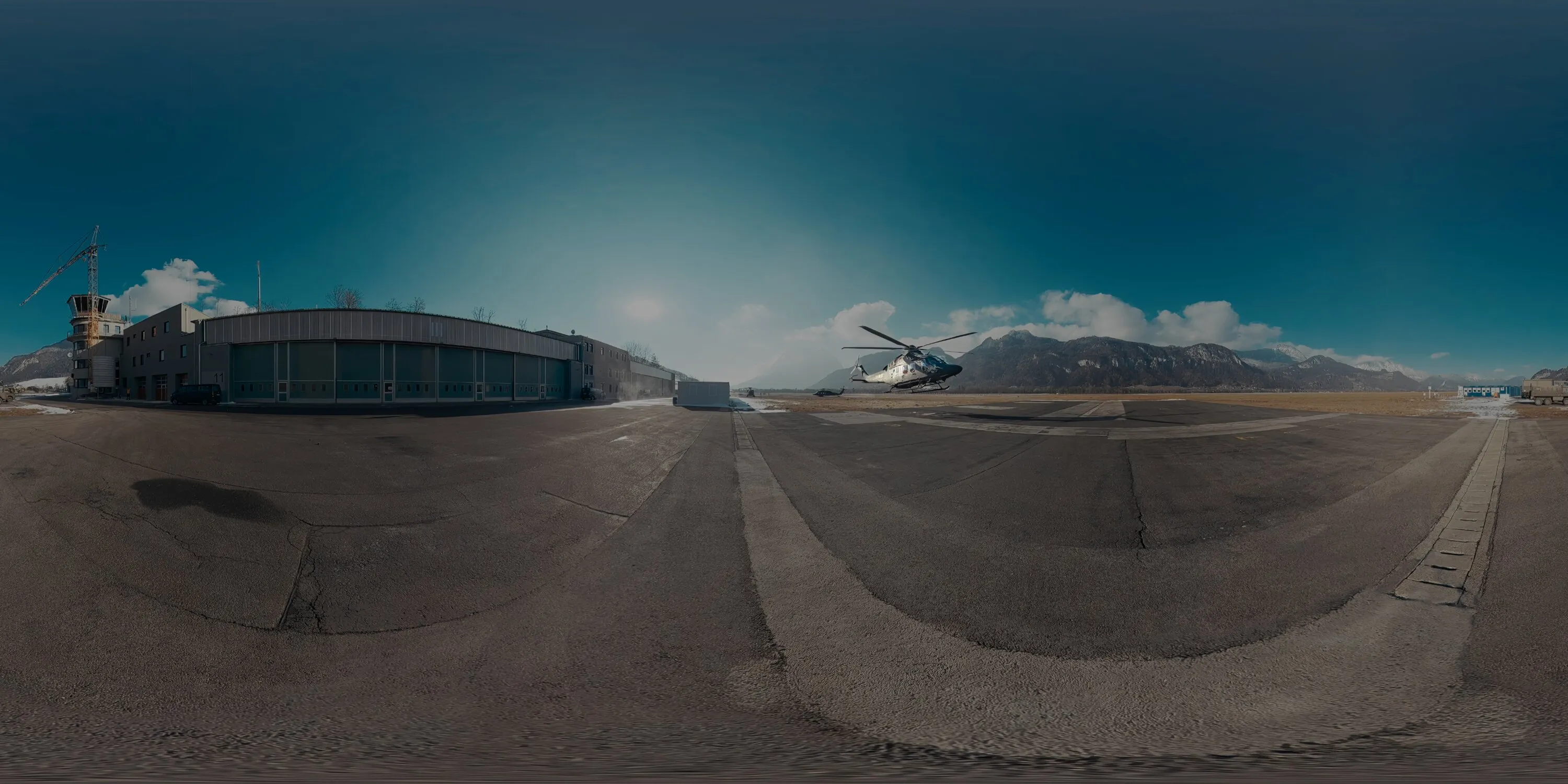 Mission Vorwärts — AW169 helicopter lifting off in front of the hangar